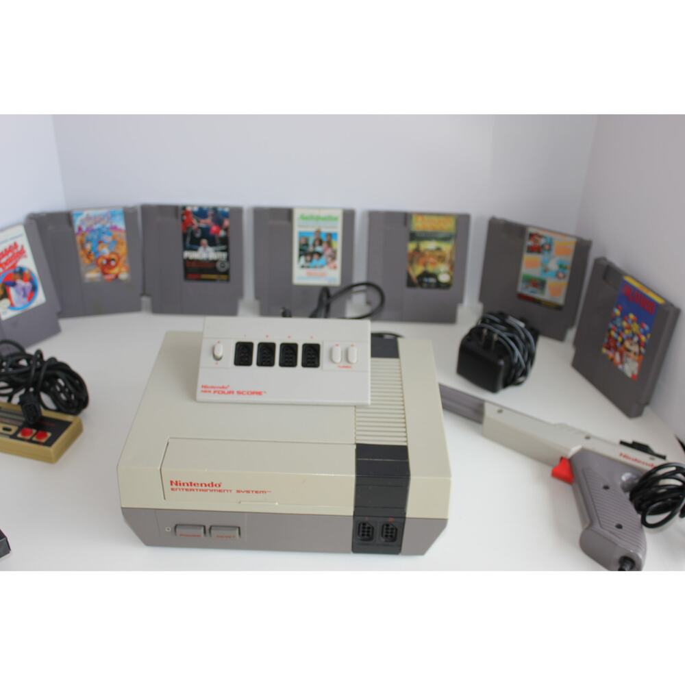 Nintendo NES Console Bundle + 7 games 1 control adapters, duck gun etc..